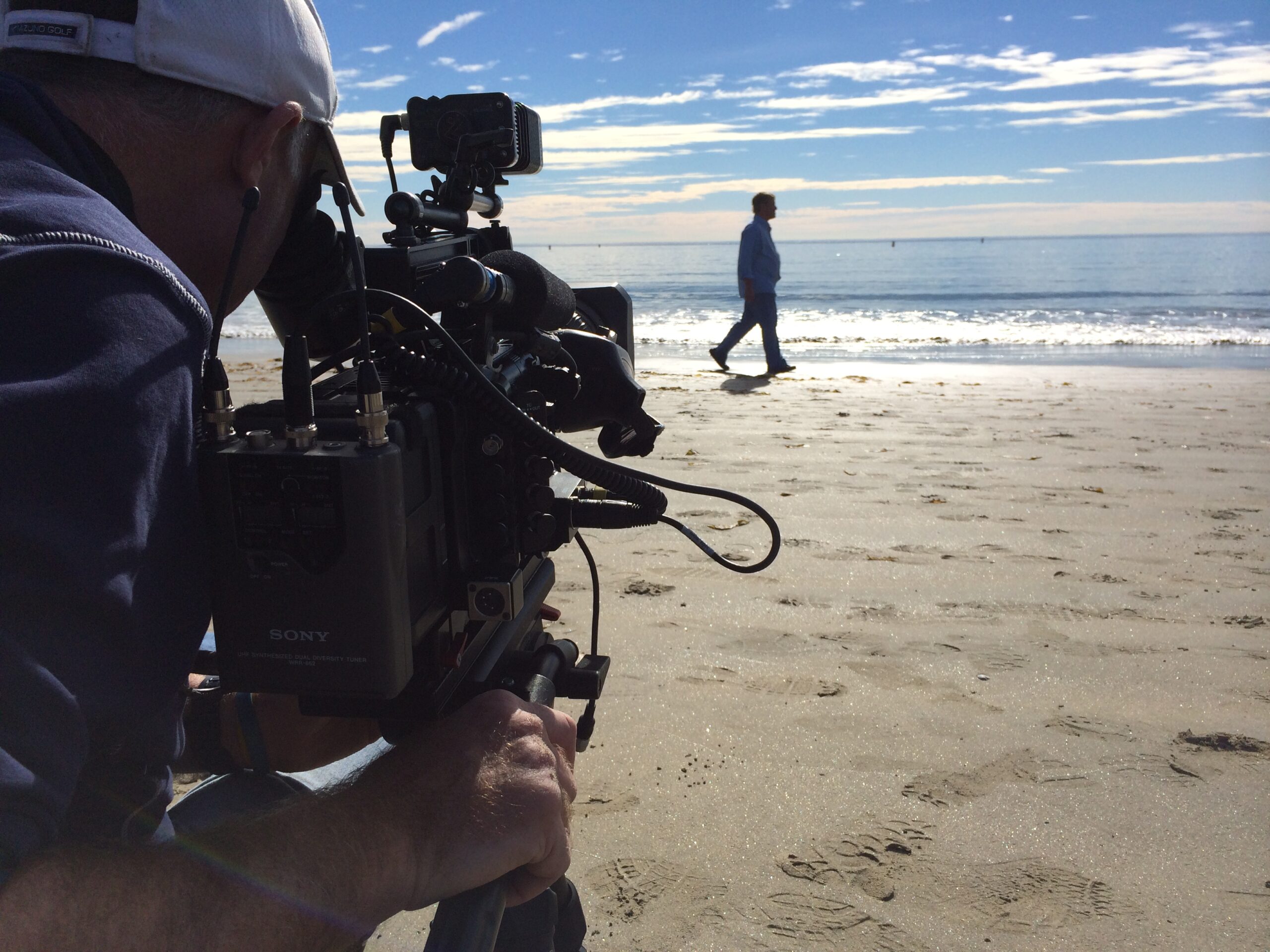 2. Leigh Steinberg walking on a beach