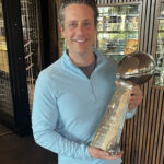Seth Wickersham holds the end game for every NFL quarterback, the Lombardi Trophy presented to the season's champion. (Seth Wickersham/ESPN)